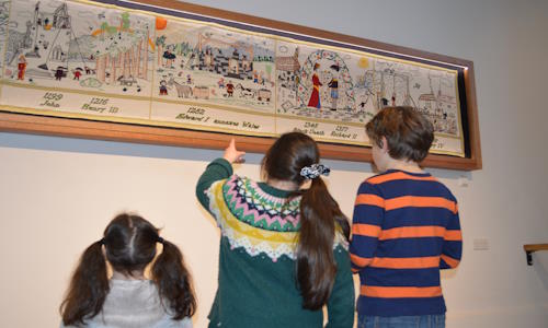 Tapestry in place on the church wall